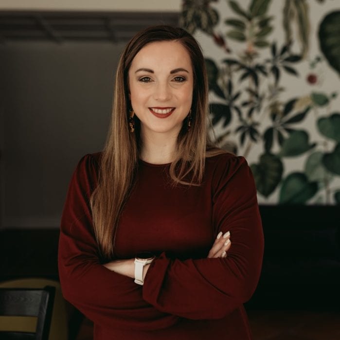 Confident woman representing workforce nutrition and health initiatives.
