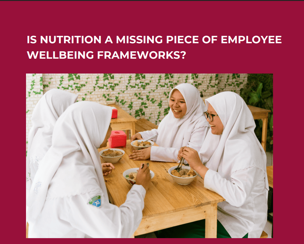 A group of workers eating food at the workplace